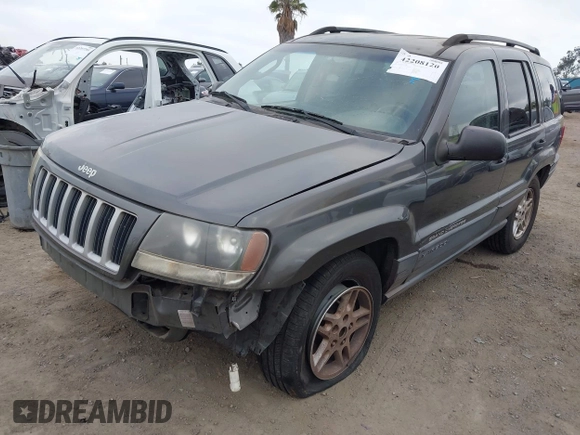 2004 Jeep Grand Cherokee Laredo with VIN 1J4GX48S34C214485, listed as a IAAI auction lot 42208120 with 164,322 mi miles and . Bid and sale history available at DreamBid. Image 2.
