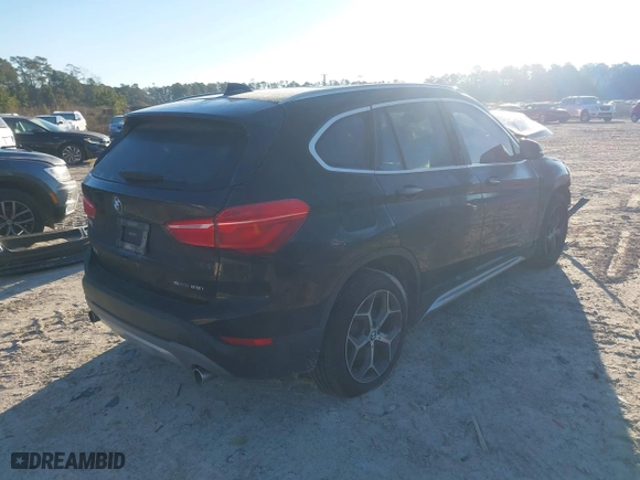 2019 BMW X1 sDrive28i with VIN WBXHU7C52K5L11560, listed as a IAAI auction lot 41354422 with 115,401 mi miles. Bid and sale history available at carsss.com. Image 4.