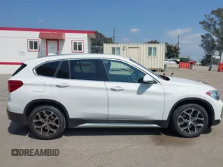 2021 BMW X1 sDrive28i z VIN WBXJG7C01M3M73496, wystawiony jako IAAI lot #42132005 z przebiegiem 23 278 mil mil oraz . Historia ofert i sprzedaży dostępna na DreamBid. Obrazek 13.