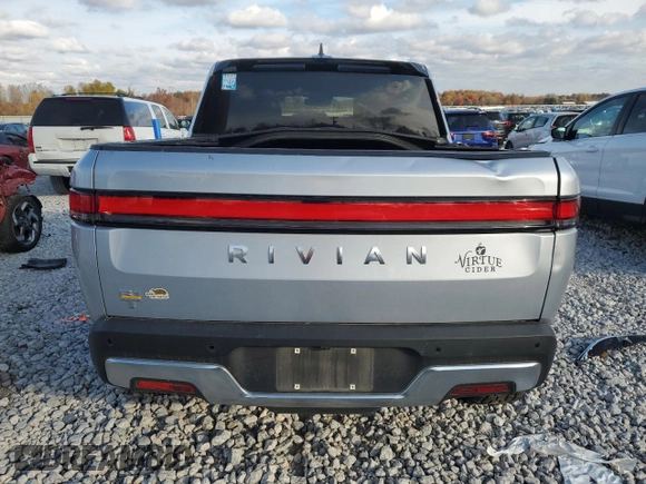 2023 Rivian R1T Adventure with VIN 7FCTGAAA2PN017170, listed as a Copart auction lot 77473014 with 28,821 mi miles and Salvage Title. Bid and sale history available at DreamBid. Image 6.