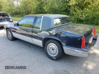 1988 Cadillac Eldorado z VIN 1G6EL1155JU600524, wystawiony jako Copart lot #59505125 z przebiegiem 110 972 mil mil oraz Szkoda całkowita • Salvage title. Historia ofert i sprzedaży dostępna na DreamBid. Obrazek 2.