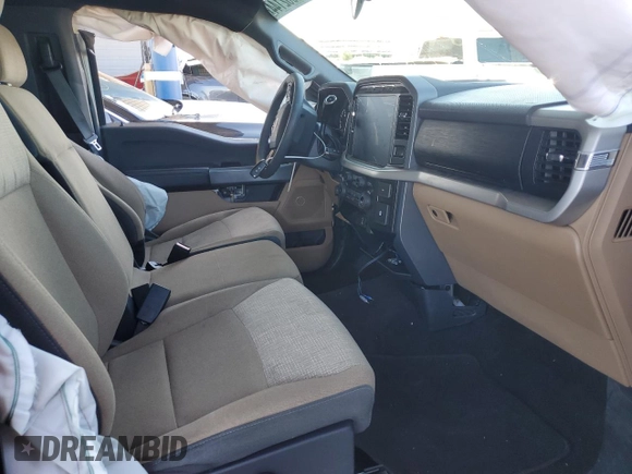 2022 Ford F-150 XL with VIN 1FTMF1C5XNKD23707, listed as a Copart auction lot 70062144 with 58,649 mi miles and Salvage title. Bid and sale history available at DreamBid. Image 7.