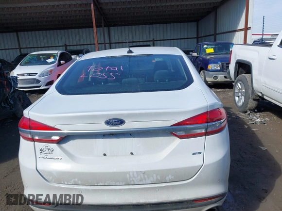 2017 Ford Fusion SE z VIN 3FA6P0H77HR277995, wystawiony jako IAAI lot #41586483 z przebiegiem 191 912 mil mil oraz . Historia ofert i sprzedaży dostępna na DreamBid. Obrazek 16.