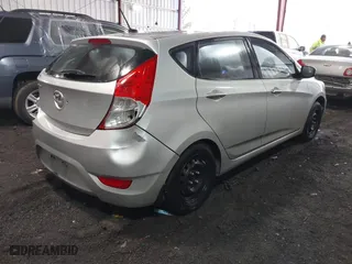 2013 Hyundai Accent GL with VIN KMHCT5AE7DU083867, listed as a IAAI auction lot 41390970 with 160,630 mi miles. Bid and sale history available at carsss.com. Image 4.