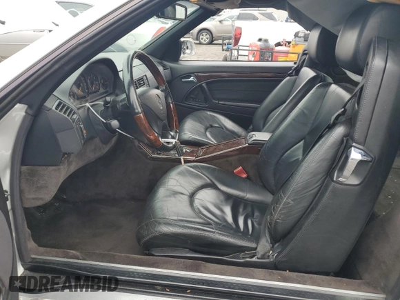 1999 Mercedes-Benz SL 500 with VIN WDBFA68F1XF177603, listed as a Copart auction lot 58983485 with 120,737 mi miles and Salvage title. Bid and sale history available at DreamBid. Image 7.