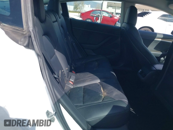 2023 Tesla Model 3 with VIN 5YJ3E1EA8PF398110, listed as a IAAI auction lot 41692006 with 112,699 mi miles and . Bid and sale history available at carsss.com. Image 8.