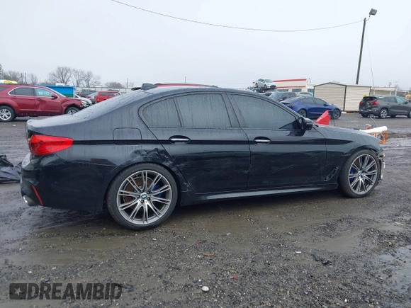 2018 BMW 5 Series M550i xDrive with VIN WBAJB9C59JB049114, listed as a IAAI auction lot 41543633 with 87,942 mi miles and . Bid and sale history available at carsss.com. Image 14.