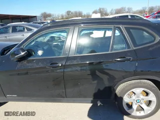2015 BMW X1 sDrive28i with VIN WBAVM1C58FV498559, listed as a IAAI auction lot 41208638 with 100,452 mi miles. Bid and sale history available at carsss.com. Image 14.