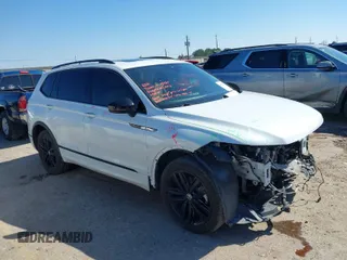 2022 Volkswagen Tiguan SE R-Line Black with VIN 3VVCB7AX4NM165115, listed as a IAAI auction lot 41624320 with 18,074 mi miles and . Bid and sale history available at DreamBid. Image 1.