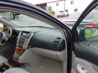 2005 Lexus RX with VIN 2T2GA31U65C040798, listed as a IAAI auction lot 41906233 with 211,026 mi miles. Bid and sale history available at carsss.com. Image 5.