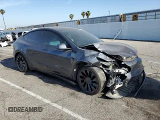 2022 Tesla Model Y Performance z VIN 7SAYGDEF1NF405329, wystawiony jako Copart lot #57249195 z przebiegiem 62 423 mil mil oraz Szkoda całkowita • Salvage title. Historia ofert i sprzedaży dostępna na DreamBid. Obrazek 4.