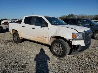 2021 GMC Canyon 4WD AT4 w/Cloth with VIN 1GTG6FEN9M1216062, listed as a Copart auction lot 80932634 with 73,308 mi miles and Salvage Title. Bid and sale history available at carsss.com. Image 4.