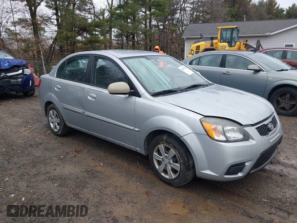 2010 Kia Rio LX with VIN KNADH4A37A6645279, listed as a IAAI auction lot 40856780 with 165,385 mi miles. Bid and sale history available at carsss.com. Image 1.