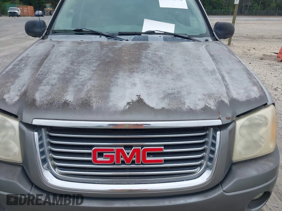 2007 GMC Envoy SLE with VIN 1GKDS13S572174308, listed as a IAAI auction lot 42211372 with 212,377 mi miles and . Bid and sale history available at DreamBid. Image 6.