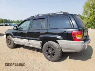 2000 Jeep Grand Cherokee Laredo with VIN 1J4GW48S6YC404063, listed as a Copart auction lot 59442725 with 268,543 mi miles and Salvage title. Bid and sale history available at DreamBid. Image 2.