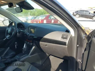 2014 Mazda CX-5 Grand Touring with VIN JM3KE4DY2E0312952, listed as a IAAI auction lot 42138721 with 99,993 mi miles and . Bid and sale history available at DreamBid. Image 5.