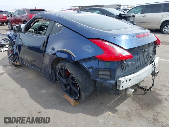 2013 Nissan 370Z z VIN JN1AZ4EH2DM380511, wystawiony jako IAAI lot #41912193 z przebiegiem Nie podano mil oraz . Historia ofert i sprzedaży dostępna na DreamBid. Obrazek 3.