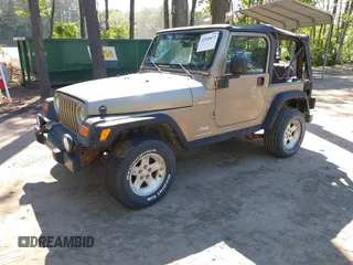 2003 Jeep Wrangler Sport z VIN 1J4FA49S13P313180, wystawiony jako IAAI lot #42349673 z przebiegiem 141 073 mil mil oraz . Historia ofert i sprzedaży dostępna na DreamBid. Obrazek 2.