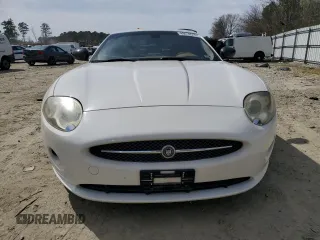 2007 Jaguar XK with VIN SAJDA44B775B05606, listed as a Copart auction lot 49419515 with 115,607 mi miles and Salvage Title. Bid and sale history available at DreamBid. Image 5.