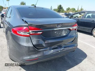 2018 Ford Fusion Hybrid SE with VIN 3FA6P0LU4JR261594, listed as a IAAI auction lot 40360797 with 128,533 mi miles. Bid and sale history available at carsss.com. Image 6.