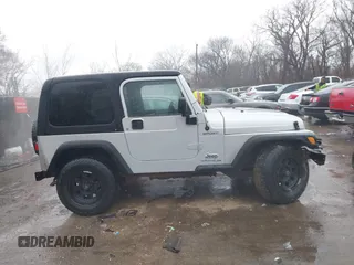 2006 Jeep Wrangler Sport Right Hand Drive with VIN 1J4F449SX6P764491, listed as a IAAI auction lot 41709726 with 290,798 mi miles. Bid and sale history available at carsss.com. Image 13.