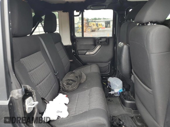 2012 Jeep Wrangler Unlimited Sport z VIN 1C4BJWDG9CL102626, wystawiony jako Copart lot #58421455 z przebiegiem 128 421 mil mil oraz Szkoda całkowita • Salvage title. Historia ofert i sprzedaży dostępna na DreamBid. Obrazek 11.