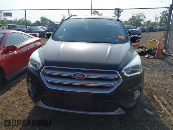 2018 Ford Escape Titanium with VIN 1FMCU9J95JUB30803, listed as a IAAI auction lot 42286536 with 63,309 mi miles and . Bid and sale history available at DreamBid. Image 13.