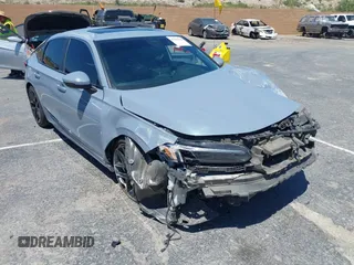 2023 Honda Civic Sport Touring with VIN 19XFL1G85PE008096, listed as a IAAI auction lot 42225610 with Not provided miles and . Bid and sale history available at DreamBid. Image 1.