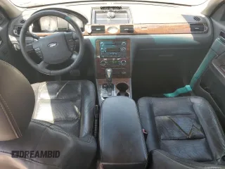 2009 Ford Taurus Limited z VIN 1FAHP25W09G118860, wystawiony jako Copart lot #54604575 z przebiegiem 212 886 mil mil oraz Szkoda całkowita • Salvage title. Historia ofert i sprzedaży dostępna na DreamBid. Obrazek 8.