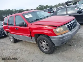 1999 Jeep Grand Cherokee Laredo with VIN 1J4GW58S0XC519908, listed as a IAAI auction lot 41789905 with 221,064 mi miles. Bid and sale history available at carsss.com. Image 14.