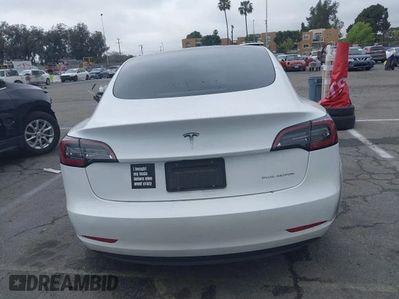 2021 Tesla Model 3 Long Range with VIN 5YJ3E1EB6MF878957, listed as a IAAI auction lot 41915482 with 59,578 mi miles. Bid and sale history available at carsss.com. Image 16.