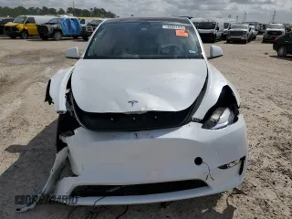 2024 Tesla Model Y Long Range with VIN 7SAYGDEE2RA335818, listed as a Copart auction lot 48821475 with 4,415 mi miles and Salvage Title. Bid and sale history available at DreamBid. Image 5.