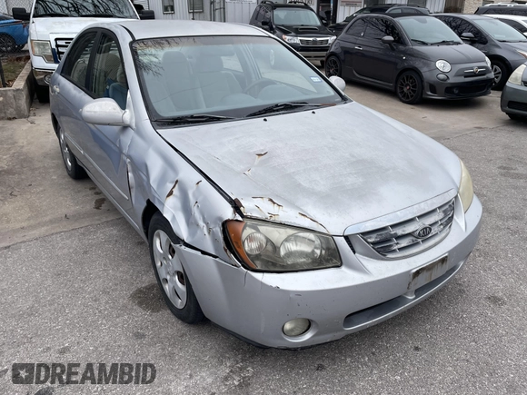 2004 Kia Spectra LX with VIN KNAFE121845043143, listed as a IAAI auction lot 41574523 with 211,758 mi miles. Bid and sale history available at carsss.com. Image 1.