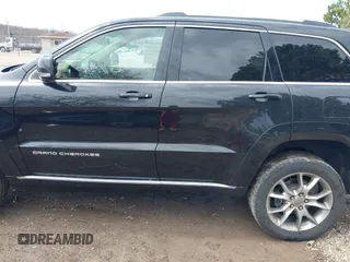 2015 Jeep Grand Cherokee Summit with VIN 1C4RJFJGXFC882787, listed as a IAAI auction lot 42098274 with 147,020 mi miles and . Bid and sale history available at DreamBid. Image 14.