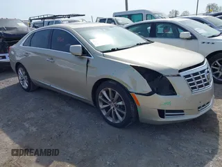 2013 Cadillac XTS Premium z VIN 2G61S5S35D9143656, wystawiony jako IAAI lot #42099511 z przebiegiem 207 055 mil mil oraz . Historia ofert i sprzedaży dostępna na DreamBid. Obrazek 1.
