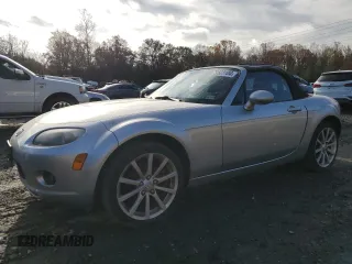 2006 Mazda MX-5 Miata Sport z VIN JM1NC25F660101493, wystawiony jako Copart lot #79503104 z przebiegiem 62 919 mil mil oraz Szkoda całkowita • Salvage title. Historia ofert i sprzedaży dostępna na DreamBid. Obrazek 1.