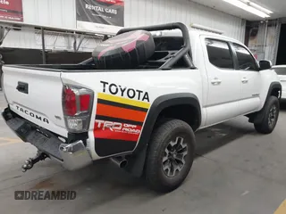 2022 Toyota Tacoma SR with VIN 3TMCZ5AN5NM480311, listed as a IAAI auction lot 42542600 with 43,297 mi miles and . Bid and sale history available at DreamBid. Image 4.
