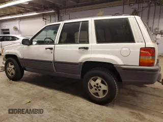 1993 Jeep Grand Cherokee Laredo with VIN 1J4GZ58SXPC554642, listed as a Copart auction lot 83268254 with 266,063 mi miles and Salvage Title. Bid and sale history available at carsss.com. Image 2.