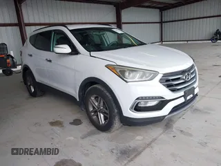 2018 Hyundai Santa Fe 2.4L z VIN 5NMZU3LB9JH083018, wystawiony jako IAAI lot #42205310 z przebiegiem 65 504 mil mil oraz . Historia ofert i sprzedaży dostępna na DreamBid. Obrazek 1.