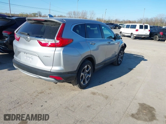 2018 Honda CR-V EX with VIN 7FARW2H56JE097214, listed as a IAAI auction lot 42061999 with 74,862 mi miles and . Bid and sale history available at DreamBid. Image 4.