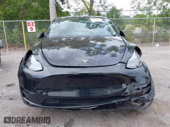 2023 Tesla Model Y Long Range with VIN 7SAYGAEE8PF928923, listed as a IAAI auction lot 41880988 with 18,468 mi miles. Bid and sale history available at carsss.com. Image 12.
