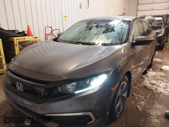 2020 Honda Civic LX z VIN 19XFC2F65LE030888, wystawiony jako IAAI lot #41609630 z przebiegiem 115 614 mil mil oraz . Historia ofert i sprzedaży dostępna na DreamBid. Obrazek 17.