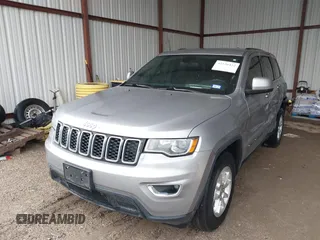2018 Jeep Grand Cherokee Laredo E with VIN 1C4RJEAG1JC275356, listed as a IAAI auction lot 42150422 with 69,720 mi miles and . Bid and sale history available at DreamBid. Image 2.