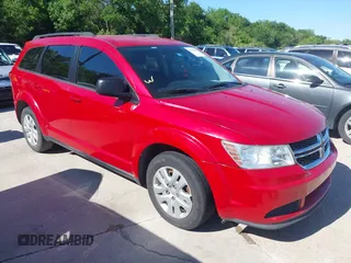 2015 Dodge Journey SE z VIN 3C4PDCAB5FT679585, wystawiony jako IAAI lot #42090600 z przebiegiem 166 876 mil mil oraz . Historia ofert i sprzedaży dostępna na DreamBid. Obrazek 1.