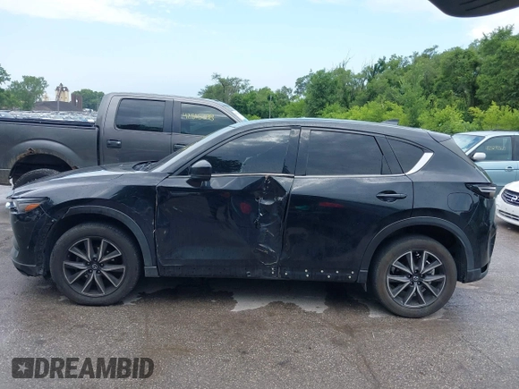 2018 Mazda CX-5 Grand Touring with VIN JM3KFBDM2J0400828, listed as a IAAI auction lot 42540846 with 254,672 mi miles and . Bid and sale history available at DreamBid. Image 14.