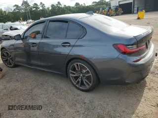 2022 BMW 3 Series M340i xDrive with VIN WBA5U9C02NFL65825, listed as a Copart auction lot 60244064 with 22,548 mi miles and Salvage Title. Bid and sale history available at DreamBid. Image 2.
