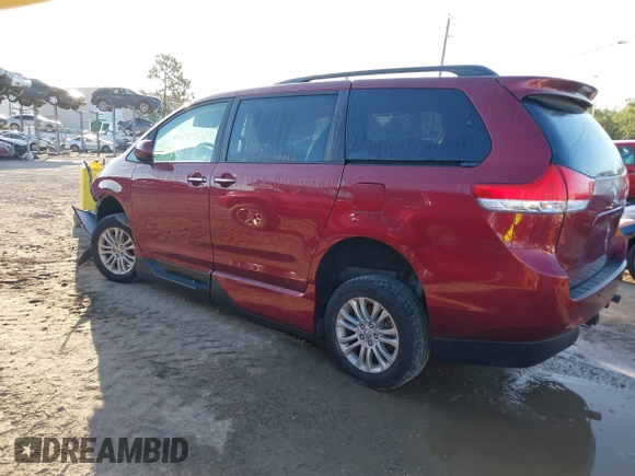 2014 Toyota Sienna XLE with VIN 5TDYK3DCXES473671, listed as a IAAI auction lot 42243030 with 70,052 mi miles and . Bid and sale history available at DreamBid. Image 3.