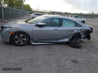 2019 Honda Civic Sedan LX with VIN 2HGFC2F62KH583213, listed as a IAAI auction lot 41935570 with 143,992 mi miles. Bid and sale history available at carsss.com. Image 15.
