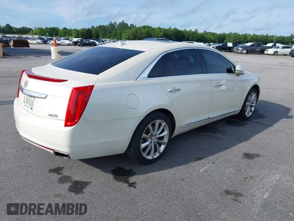 2013 Cadillac XTS Premium z VIN 2G61S5S35D9103948, wystawiony jako IAAI lot #42090444 z przebiegiem 154 728 mil mil oraz . Historia ofert i sprzedaży dostępna na DreamBid. Obrazek 4.