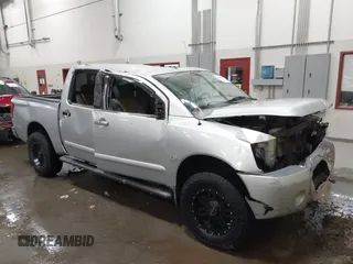 2004 Nissan Titan LE with VIN 1N6AA07B44N512889, listed as a IAAI auction lot 41569019 with 154,655 mi miles. Bid and sale history available at carsss.com. Image 1.
